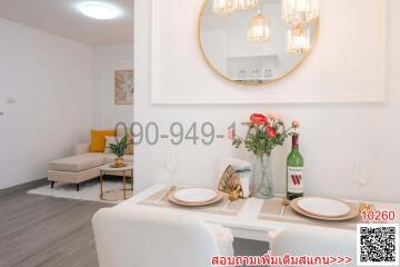 Modern dining room with elegant decor and a cozy adjacent sitting area
