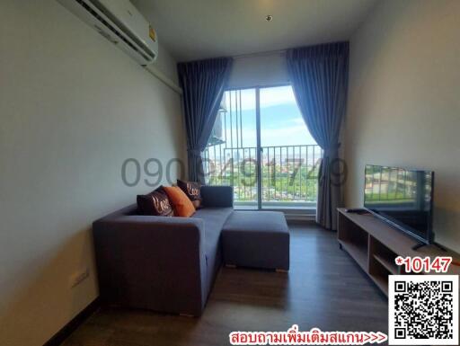 Modern living room with natural light and balcony view