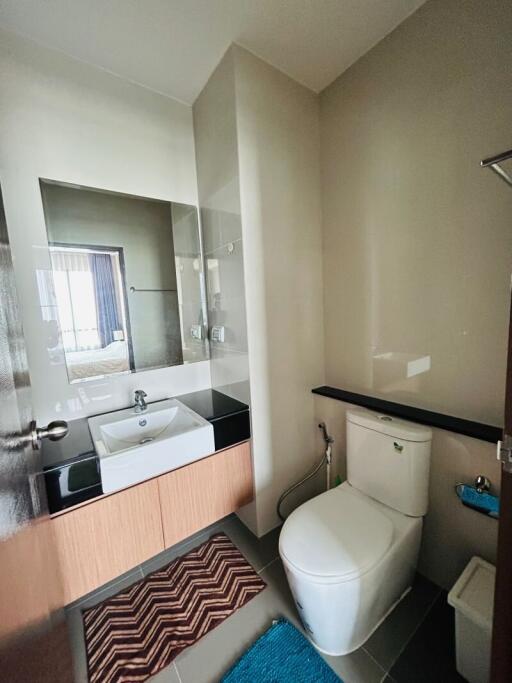 Modern bathroom interior with grey tiles