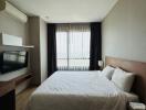 Modern bedroom with a large bed, wooden headboard, and city view