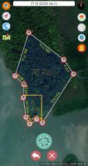 Aerial view of a large land area marked with boundaries for real estate development