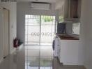 Modern kitchen with reflective tile flooring and abundant natural light