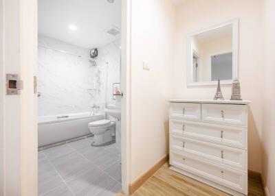 Spacious modern bathroom with bathtub and white vanity