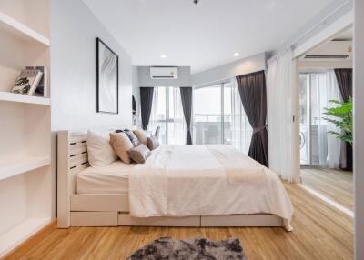 Modern bedroom with attached balcony in a residential apartment