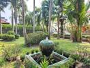 Lush garden with water feature and tropical plants