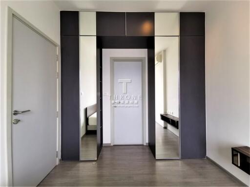 Modern entryway with sleek design and connecting rooms