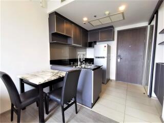 Modern kitchen with marble countertops and sleek cabinetry