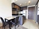 Modern kitchen with marble countertops and sleek cabinetry