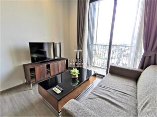 Bright and modern living room with balcony access