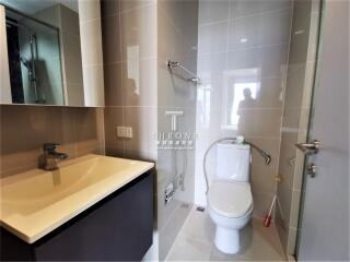 Modern bathroom with clean design featuring vanity, toilet, and shower