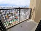 City view from high-rise apartment balcony