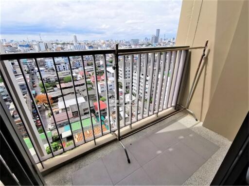 City view from high-rise apartment balcony