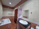 Spacious bathroom with modern fixtures and pink tiling