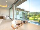 Luxurious bathroom with large bathtub, floor-to-ceiling windows, and scenic view