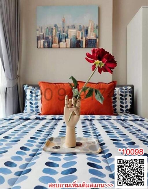 Stylish bedroom with artistic decor and cityscape painting