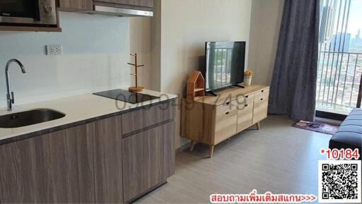 Modern living space with integrated kitchen unit