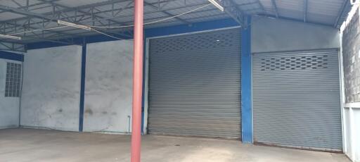 Spacious industrial warehouse with large roller doors