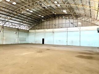 Spacious industrial warehouse interior with high ceiling