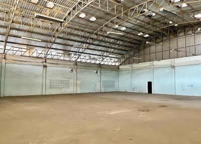 Spacious industrial warehouse interior with high ceiling