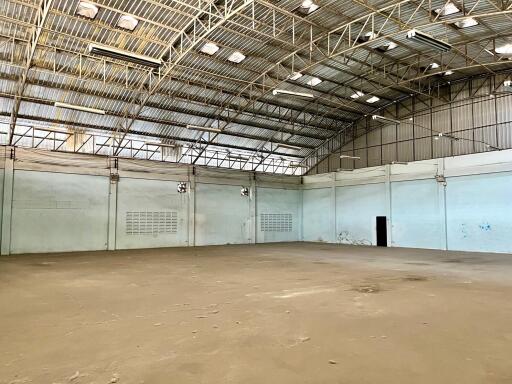 Spacious industrial warehouse interior with high ceiling