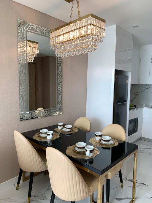 Elegant dining area with modern furniture and decorative lighting