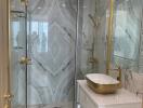 Elegant bathroom with marble walls and gold accents