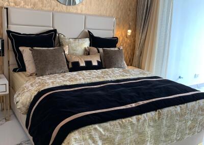 Luxurious modern bedroom with elegant decor and abundant natural light
