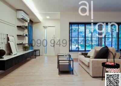 Spacious and modern living room with large windows and stylish furniture