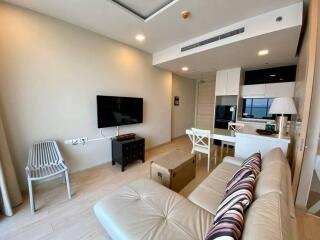 Spacious and modern living room with a comfortable seating area and integrated kitchen