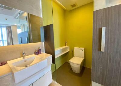 Modern bathroom with bright yellow walls