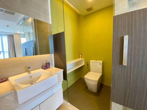 Modern bathroom with bright yellow walls