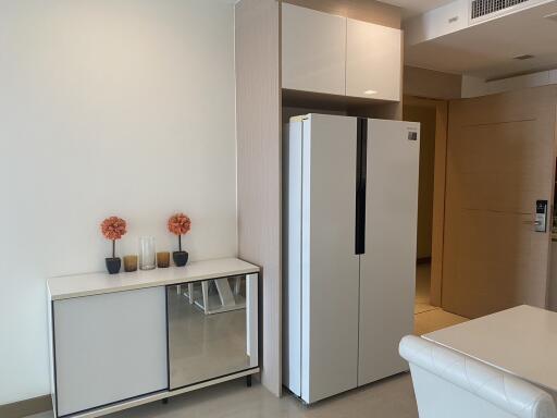 Modern kitchen with large refrigerator and minimalistic decor