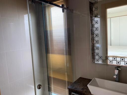 Modern bathroom with glass shower and elegant vanity