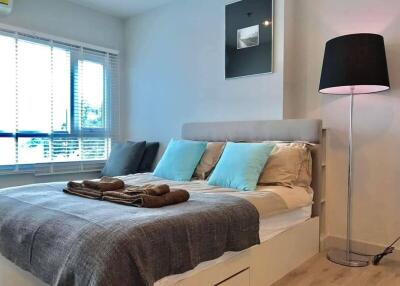 Modern Bedroom with Elegant Bedding and Stylish Lamp