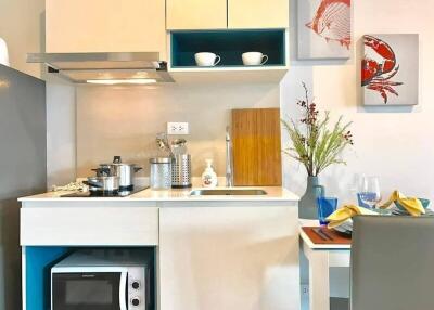 Modern compact kitchen with sleek design and vibrant decor