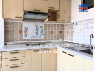 Modern kitchen with ample cabinets and stylish backsplash