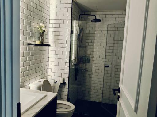 Modern bathroom with white subway tiles and walk-in shower
