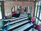 Elegant lobby with monochrome striped flooring and stylish furnishings
