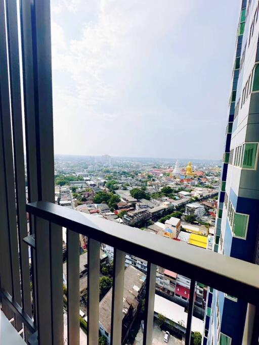 City view from high-rise apartment balcony