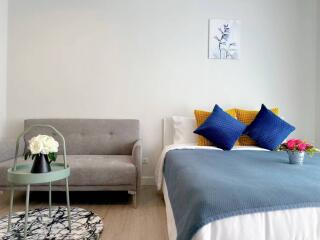 Modern minimalist bedroom with comfortable furnishings