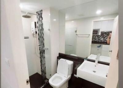 Modern bathroom with white fixtures and designer tiles