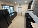 Modern kitchen with sleek countertops and well-equipped appliances