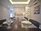 Elegantly set dining table in a modern dining room with ambient lighting