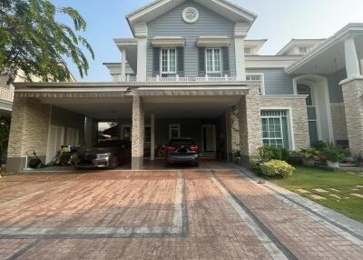 Elegant two-story residential home with a spacious driveway and attached garage
