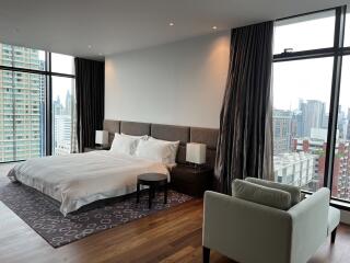 Spacious modern bedroom with city view