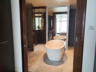 Modern bathroom with freestanding tub and elegant marble flooring