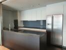 Modern kitchen with stainless steel appliances and sleek cabinetry