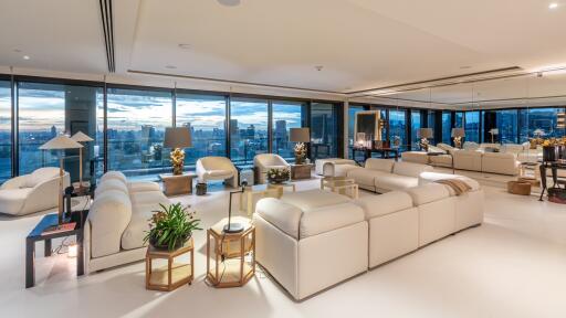 Spacious and well-lit living room with city skyline view