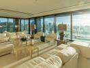 Spacious living room with modern furniture and panoramic city views