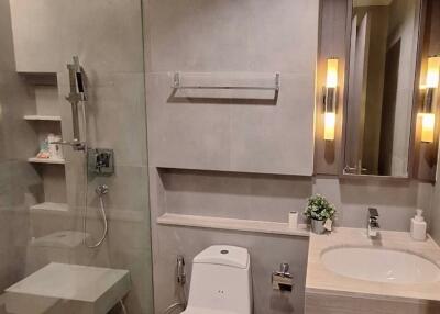 Modern bathroom with elegant fixtures and warm lighting